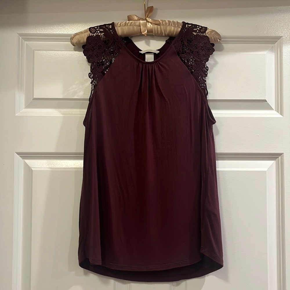 Oxblood colored top with appliqué sleeves